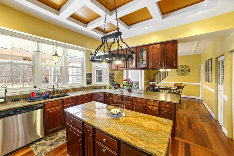 Kitchen with coffered ceiling and island in Catonsville, MD