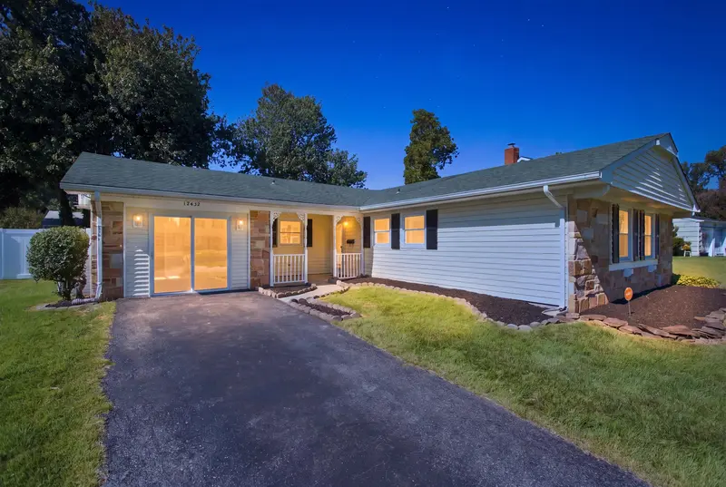 Stone-front rambler at twilight in Bowie, MD